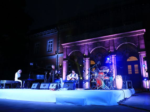 The quartet performing in the courtyard of the CPAFFC